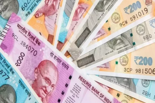 Rupee drops to record low on RBI rate cut bets, stop losses